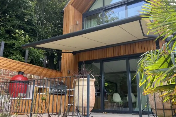 wooden home with beige markilux 990